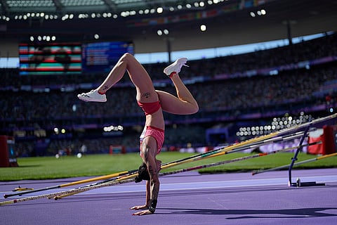 Anicka Newell prepares for the women's pole vault qualification